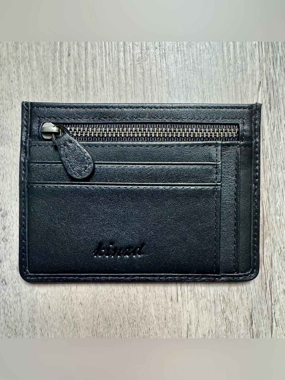 Kinzd minimalist leather card holder by Kinzd, featuring a zippered compartment